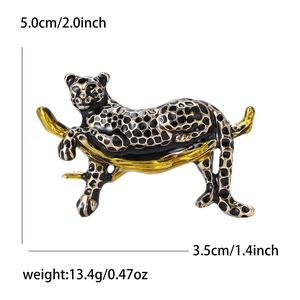 Detailed view of enamel leopard brooch with dimensions 3.5cm by 5.0cm and weight 13.4g