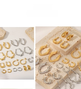 French vintage style 18K gold plated stainless steel earrings on travertine stone