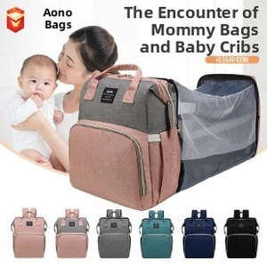 Detail view of multifunctional diaper bag converting into a foldable baby bed with net