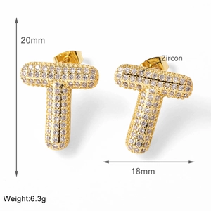 Macro detail of T-letter gold stud earrings with zircon inlay showing 20mm dimensions