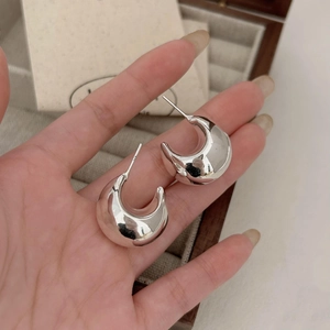 Macro shot of 925 sterling silver hoop earrings with S925 hallmark engraving