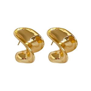 Minimalist gold plated C-shape hoop earrings with a polished abstract twisted design