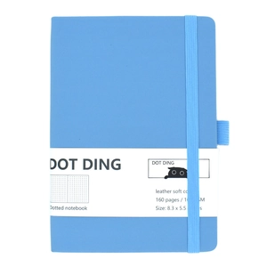 Detailed view of blue leather soft cover dotted journal with 160 pages and elastic strap