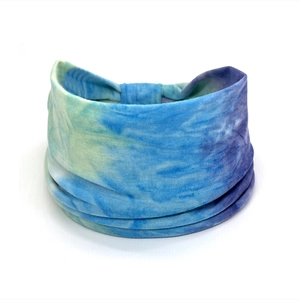Close-up of bohemian paisley tie-dye stretchy cotton wide headband in blue and purple