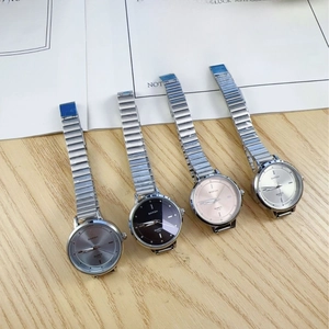 Minimalist silver chain strap quartz watches with multi-color dials on wood background