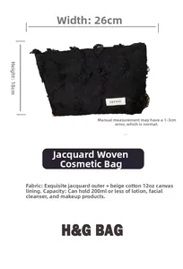 Detail of black jacquard makeup bag showing tassel texture and dimensions 26x18cm