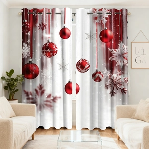 Detail showing red Christmas ball prints and snowflake patterns on the velvet curtain fabric