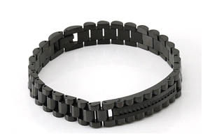 Detailed close-up of a black stainless steel link bracelet featuring watch strap style design