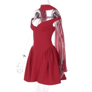Detail of red sleeveless mini dress with sweetheart neckline and ruffled skirt