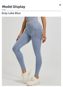 Detail view of high waist yoga leggings in grey lake blue with functional side mesh pocket