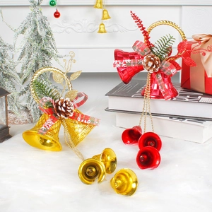 Festive Christmas bell ornaments with pine cones and checkered bows on snowy backdrop