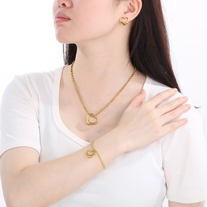 Golden heart jewelry set with hollow heart pendants and beaded chain for women