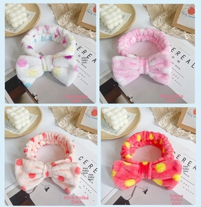 Detailed view of four colorful polka dot coral fleece headbands in a stylish grid layout
