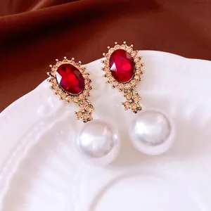 Vintage palace style pearl drop earrings with red gemstone and sparkling crystals