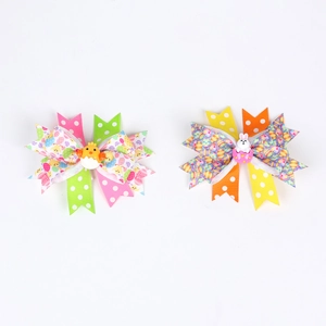 Handmade Easter bow hair clips featuring a chick and rabbit with Happy Easter ribbon patterns