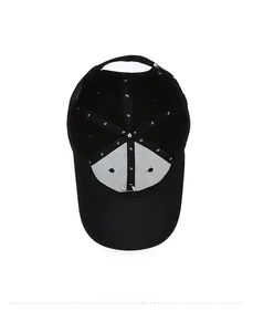 Close-up of internal black cotton baseball cap showing 100% cotton label and reinforced seams
