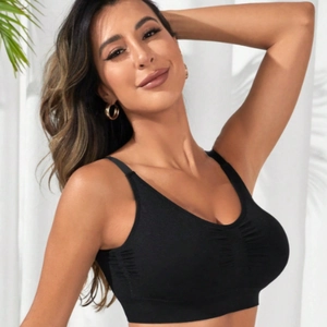 Seamless black sports bra with ruched front and wide straps for yoga and fitness training