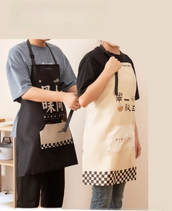 Detail of adjustable long neck strap and waist tie on waterproof kitchen apron