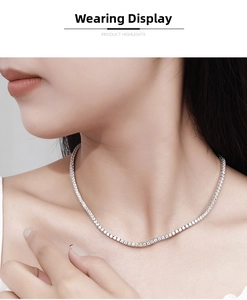 Detailed view of elegant silver tennis necklace with round-cut stones on a woman's neck