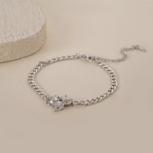 Macro view of silver Cuban chain bracelet with marquise zircon cluster and lobster clasp