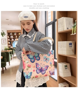 Detailed shot of large canvas tote bag with butterfly and floral prints for daily shopping
