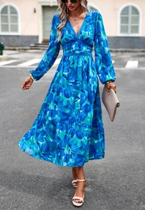 Close-up of blue floral maxi dress featuring V-neckline with delicate lace trim detail