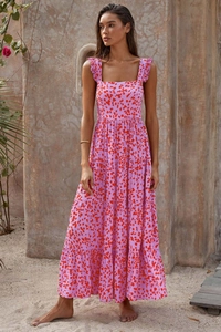 Detail of bohemian maxi dress showing pink leopard print and layered ruffle tiered skirt