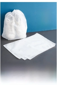 Macro detail of breathable non-woven white shoe storage bag with drawstring closure