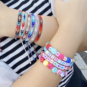 Bohemian seed bead bracelet set with smiley face and geometric woven patterns