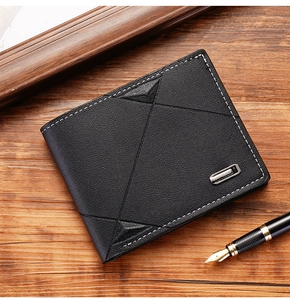 Close-up of black men's wallet with white stitching and silver brand metal plate