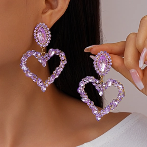 Exaggerated oval heart-shaped rhinestone drop earrings in purple and gold tones