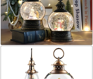 Detail of Christmas snow globe lantern with snowman and warm festive lighting decoration