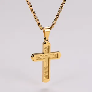 Close-up of golden stainless steel cross pendant with laser engraved Spanish Lord's Prayer
