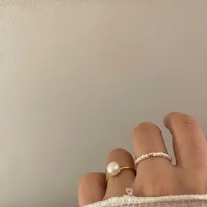 Elegant set of gold pearl open ring and minimalist elastic beaded freshwater pearl band