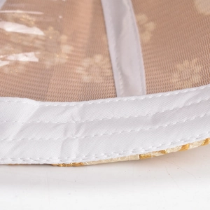 Macro view of Chinese style baseball cap interior with mesh lining and golden embroidery