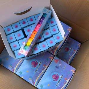 Macro view of octopus shaped multi-colored highlighters in ocean themed packaging box