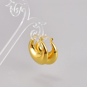 Boucles d'oreilles créoles dorées épaisses minimalistes avec finition miroir