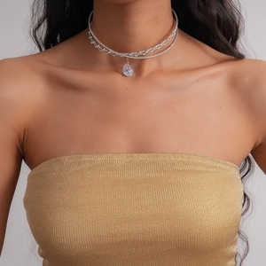 Detail of double-layer silver choker with sparkling zircons and a pear-cut pendant
