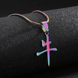 Macro view of iridescent rainbow Niu character pendant with sleek snake chain necklace