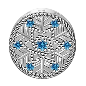 Detailed macro view of 925 sterling silver snowflake charm with blue crystals and rope texture