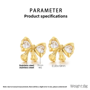 Detail view of 18K gold bow stud earrings with heart-shaped zircon and size specs