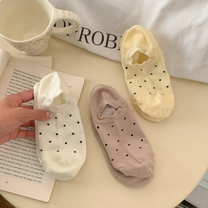 Polka dot low cut invisible socks for women in beige and coffee colors on table