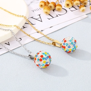 Detailed close-up of colorful rhinestone-encrusted ball pendants on gold and silver chains