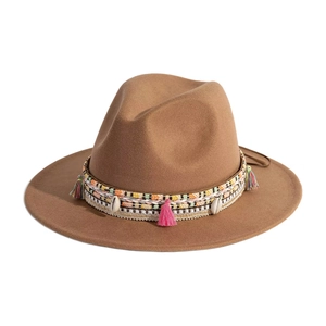 Detail of western flat brim fedora with ethnic woven band, tassels and shell ornaments