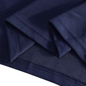 Macro view of dark blue polo shirt piqué mesh fabric and high-density hem stitching