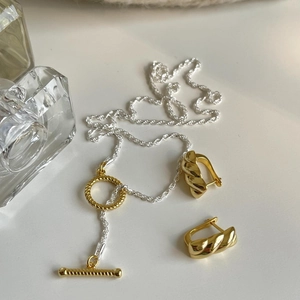 Minimalist 925 sterling silver jewelry set featuring golden OT buckle necklace and twist earrings