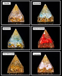 Detail view of various Orgonite energy pyramids with natural stones and copper coils