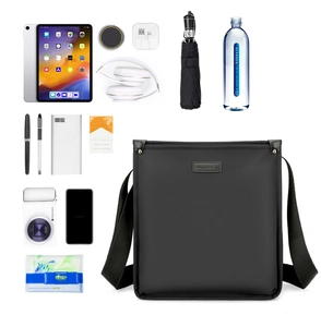 Flat lay of men's business messenger bag showing internal storage for tablet and gadgets