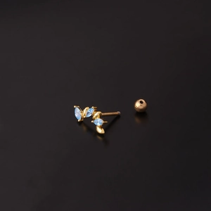 Gold 16G stainless steel cartilage stud with blue marquise crystals on black background