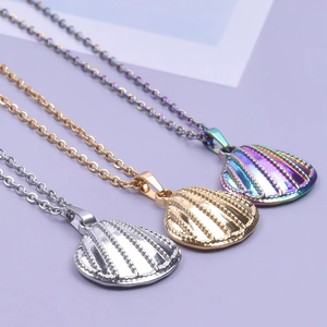 Three shell shaped pendants in silver gold and rainbow finishes on stainless steel chains